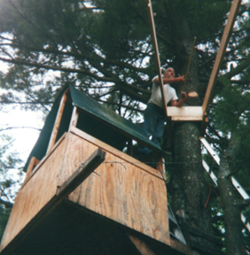 constructing 2nd story of treehouse